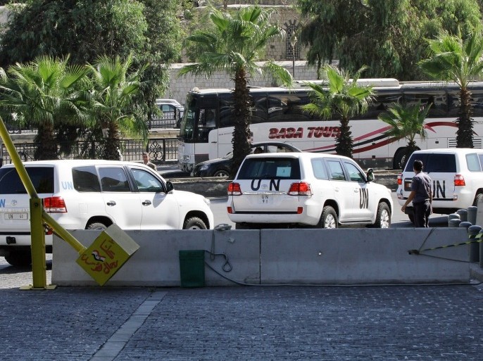 A convoy of UN vehicle with chemical weapons experts on board leaves an hotel on September 26, 2013 in the Syrian capital Damascus. The experts arrived in Syria on September 25 on their second mission to the country, where they will examine some 14 alleged incidents involving the use of chemical weapons.