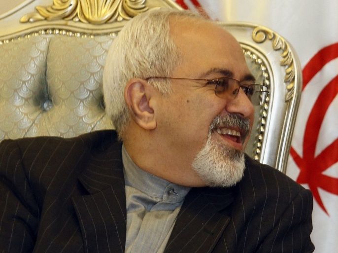 Iran's Foreign Minister Mohammed Javad Zarif speaks to his Iraqi counterpart Hoshyar Zebari, not seen, after arriving at the Baghdad International Airport, Iraq, Sunday, Sept. 8, 2013. Iran's new foreign minister has arrived in neighboring Iraq on his first trip abroad since taking office.