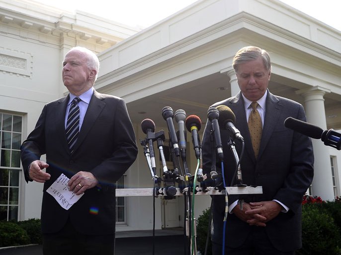: US Senator John McCain (L), R-AZ, and Senator Lindsey Graham, R-SC, arrive to speak to the media following their meeting with US President Barack Obama at the White House in Washington, DC, on September 2, 2013. McCain said Monday that Congress's failure to authorize military action in Syria would be "catastrophic" because it would undermine US credibility. AFP Photo/Jewel Samad