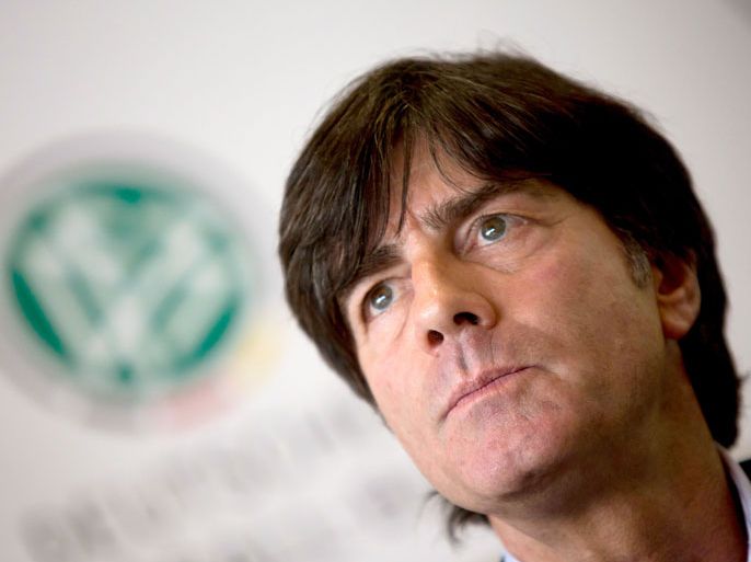 German head coach Joachim Loew attends a press conference in the headquarters of the German Football Association in Frankfurt am Main, central Germany, on October 18, 2013. Loew has signed a new contract that will take him through until 2016, the German football federation (DFB) announced. AFP PHOTO / DPA / FRANK RUMPENHORST GERMANY OUT