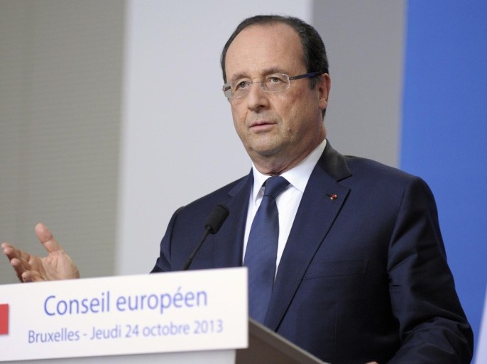 France's President Francois Hollande addresses a news conference at an European Union leaders summit in Brussels October 25, 2013. REUTERS/Laurent Dubrule