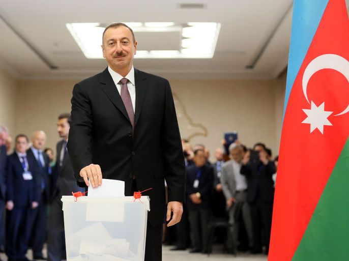 Azerbaijan's President Ilham Aliyev poses for the media as he casts his ballot in a polling station in Baku, Azerbaijan, 09 October 2013. A total of 5492 polling stations were reported to have opened for voters in the oil-rich former Soviet Caucasus republic of Azerbaijan. Azerbaijan's Central Election Commission has registered ten candidates for the presidential election, with observers expecting the incumbent president Ilham Aliyev to easily win a third five-year term as head of state. Aliyev, 51, has run the energy-rich country wedged between the Caspian Sea and the Caucasus southern flank since 2003, when he was hand-picked by his father Heydar, who had ruled the former Soviet republic since 1993. EPA/SERGEI ILNITSKY