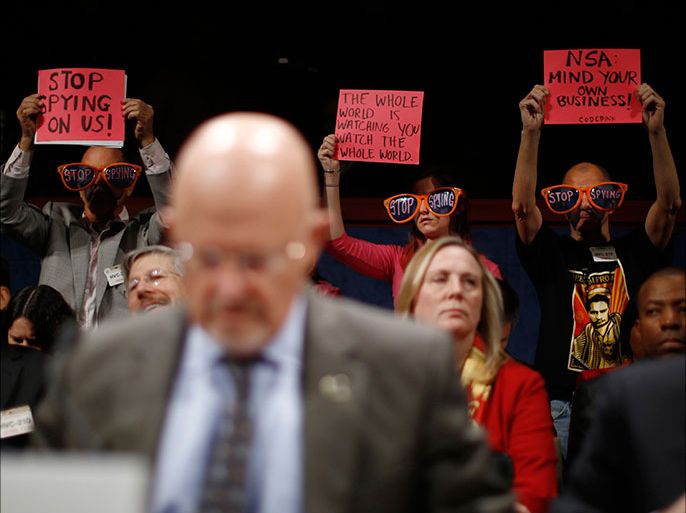 U.S. Director of National Intelligence James Clapper is pictured as protesters call for an end to alleged U.S. spying practices, at a House Intelligence Committee hearing on Capitol Hill in Washington, October 29, 2013. The hearing was on the potential changes to the Foreign Intellience Surveillance Act (FISA). REUTERS/Jason Reed (UNITED STATES - Tags: POLITICS MILITARY CRIME LAW)