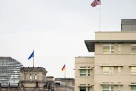 Berlin, Berlin, GERMANY : The stars and stripes fly on top of the US embassy (R) next to the German parliament (L) in Berlin on October 25, 2013. The alleged US spying on German Chancellor Angela Merkel's mobile phone may have been run out of its Berlin embassy, less than a kilometre (mile) from the chancellery, media reported. AFP PHOTO / ODD ANDERSEN
