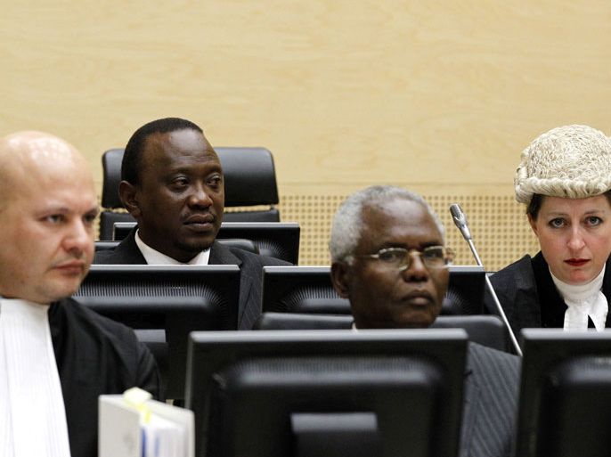 15342055 - The Hague, -, NETHERLANDS : (FILES) This picture taken on August 8, 2011 shows Kenyan Deputy Prime Minister and Finance Minister Uhuru Kenyatta (2ndL), and Cabinet secretary Francis Muthaura (2ndR) attend a hearing, at the International Criminal Court in The Hague. Ethiopia's foreign minister opened a special African Union summit on October 11, 2013 with a scathing attack on the International Criminal Court, blasting what he said was its "unfair" and "totally unacceptable" treatment of Africa. The special summit comes amid mounting tensions between The Hague-based court and Kenya, whose president and vice-president have been charged with committing crimes against humanity during election-related violence in 2007-2008. AFP PHOTO/ ANP /BAS CZERWINSKI/ POOL