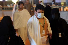 Muslim piligrims arrive for performing morning prayer in Mecca's Grand Mosque, on October 13, 2013, as hundreds of thousands of Muslims have poured into the holy city of Mecca for the annual hajj pilgrimage. The hajj is one of the five pillars of Islam and is mandatory once in a lifetime for all Muslims provided they are physically fit and financially capable
