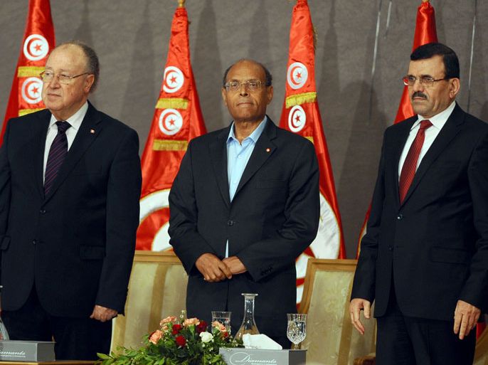 TUNISIA : Tunisian President Moncef Marzouki (C), Constituent Assembly's President Mustapha Ben Jaafar (L) and Prime Minister Ali Laarayedh arrive for a meeting as part of the dialogue between Tunisia's ruling Islamists and the opposition aimed at ending a two-month crisis on October 5, 2013 at the Palais des Congres in Tunis. Tunisia's ruling Islamist Ennahda party and the opposition signed a roadmap for the creation of a government of independents within three weeks. AFP PHOTO FETHI BELAID