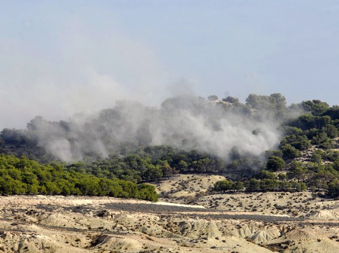 A picture taken on October 19, 2013 shows smoke billowing after an attack by Tunisian security forces during a military operation to hunt down a jihadist cell blamed after two policemen were killed this week near Goubellat in the Mount Taouyer area of Beja region. Tunisian forces killed nine "terrorists" and seized explosives AFP PHOTO KHALIL