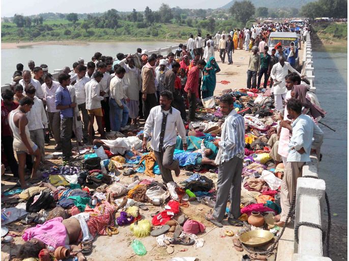 Bodies are pictured on a bridge following a stampede outside the Ratangarh Temple in Datia district, India's Madhya Pradesh state, on October 13, 2013. A stampede on a bridge outside a Hindu temple killed at least 60 people in India and dozens more may have died after they leapt into the water below, police said.