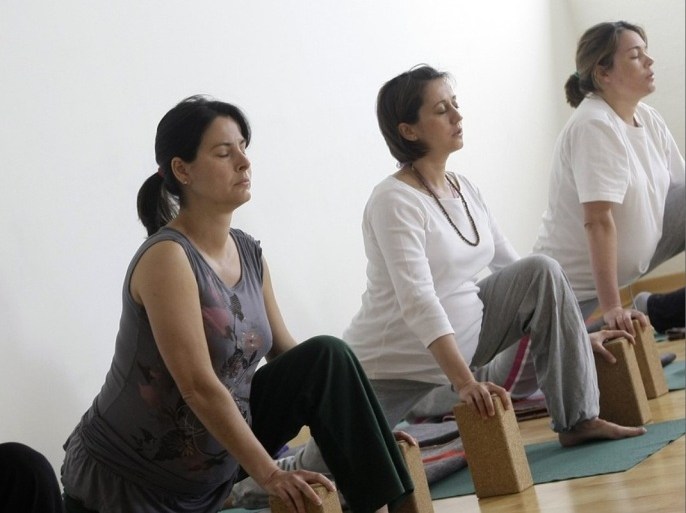 Pregnant women attend a yoga class in Madrid March 17, 2009.