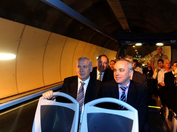 Israeli Prime Minister Benjamin Netanyahu (L) participates in the inauguration of the Carmel tunnels in Haifa, Israel 30 November 2010. The tunnels are part of Israel's first urban toll road, first such major project of a Chinese contractor in Israel. The 6,5km-kilometer-long project that cost 300 million USD to build, is expected to improve the flow of traffic in Haifa. EPA/AVI OHAYON ISRAEL OUT