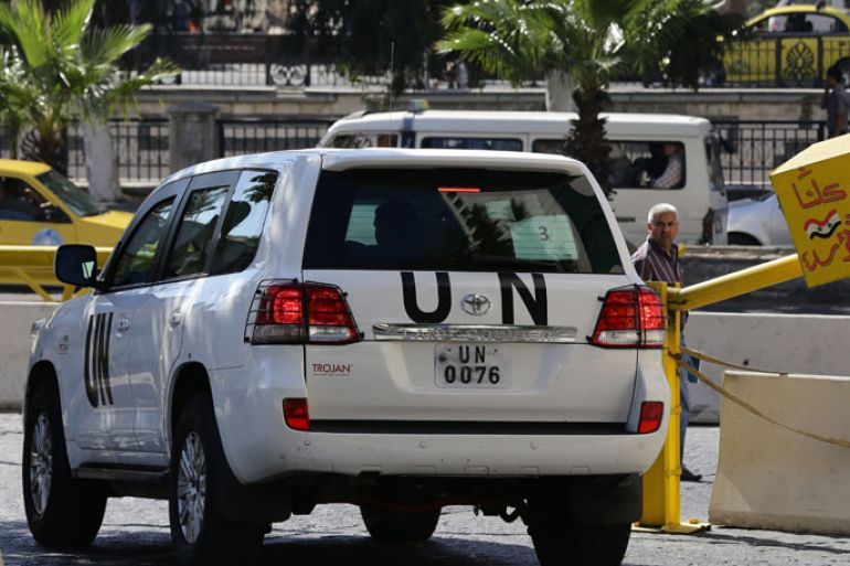 A United Nations vehicle carrying inspectors from the Organisation for the Prohibition of Chemical Weapons (OPCW) leaves a hotel in Damascus on October 7, 2013, as they continue their work to verify details of Syria's chemical arsenal and oversee their destruction. Syria agreed to give up its chemical arsenal under last month's UN resolution that enshrined an agreement struck between Washington and Moscow aimed at averting US military action
