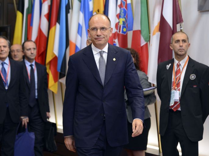 Italian Prime Minister Enrico Letta talks to the media following the first day of the European Union Summit of Heads of States held at the European Union Council building in Brussels on October 25, 2013. Union heads of state and government opened a two-day summit on October 24, focusing notably on prospects for growth from the digital economy amid data privacy concerns, plus lessons from the Lampedusa migrant tragedy. AFP PHOTO / Thierry Charlier