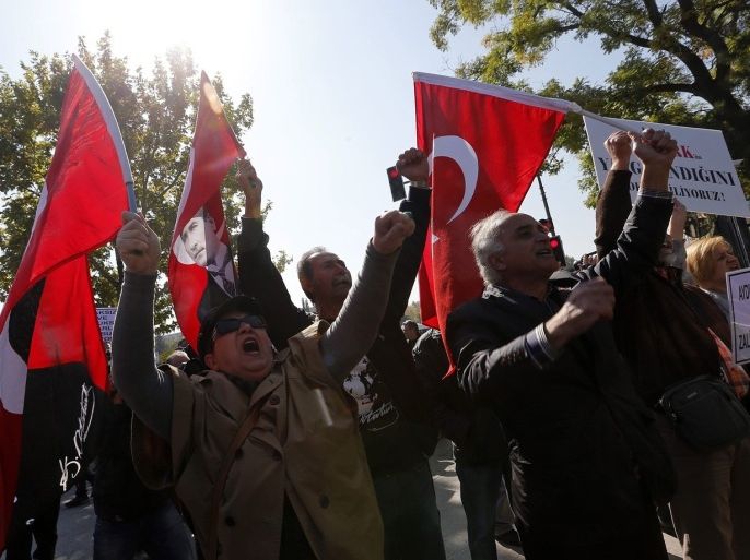 Relatives of detained military officers shout slogans in front of the Chief of Staff Headquarters in Ankara October 9, 2013. Turkey's appeals court upheld convictions on Wednesday of top retired military officers for leading a plot to overthrow Prime Minister Tayyip Erdogan's government a decade ago in a case underlining civilian dominance over a once all-powerful army. The court overturned convictions of dozens of less prominent defendants among more than 300 officers sentenced last September in the "Sledgehammer" conspiracy, said to have included plans to bomb mosques in Istanbul to pave the way for an army takeover.