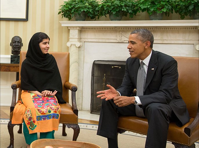 This official White House photo showsPresident Barack Obama, First Lady Michelle Obama, and their daughter Malia meet with Malala Yousafzai, the young Pakistani schoolgirl who was shot in the head by the Taliban a year ago, in the Oval Office,