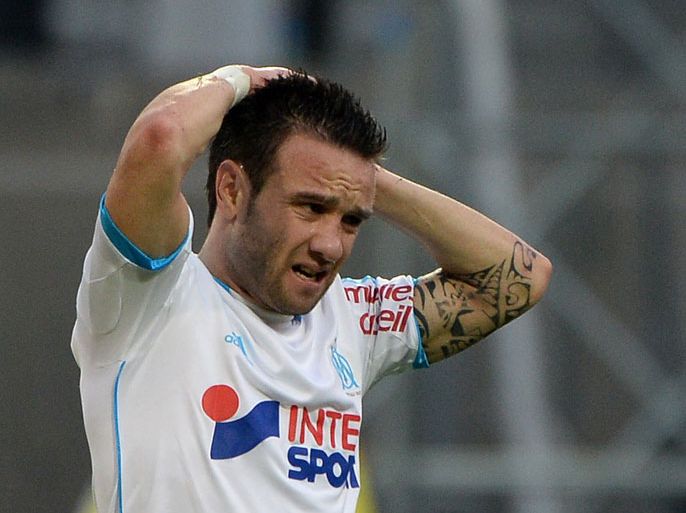 Marseille's French midfielder Mathieu Valbuena reacts during the French L1 football match between Marseille and Reims at the Velodrome stadium in Marseille on October 26, 2013. Reims won 3-2. AFP PHOTO / BORIS HORVAT