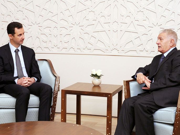 handout picture released by the official Syrian Arab News Agency (SANA) on October 7, 2013 shows Syrian president Bashar al-Assad (L) meeting Palestinian Fatah's central committee member Abbas Zaki, in Damascus. AFP PHOTO