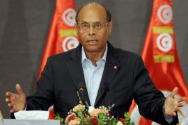 Tunisian President Moncef Marzouki speaks during a meeting as part of the dialogue between Tunisia's ruling Islamists and the opposition aimed at ending a two-month crisis on October 5, 2013 at the Palais des Congres in Tunis. Tunisia's ruling Islamist Ennahda party and the opposition signed a roadmap for the creation of a government of independents within three weeks. AFP PHOTO FETHI BELAID