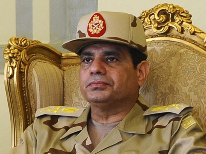 Egypt's Defense Minister Abdel Fattah al-Sisi is seen during a news conference in Cairo on the release of seven members of the Egyptian security forces kidnapped by Islamist militants in Sinai, in this May 22, 2013 file photo. Anxious over months of turmoil in Egypt, military officers are pushing popular army chief Abdel Fattah al-Sisi to run for president, after a 2011 popular uprising had inspired hopes for democratic change in a country long dominated by generals. Sisi ousted Egypt's first freely-elected president, Mohamed Mursi, the man who appointed him, in July after mass protests against the Islamist leader's rule. REUTERS/Stringer (EGYPT - Tags: MILITARY HEADSHOT POLITICS)