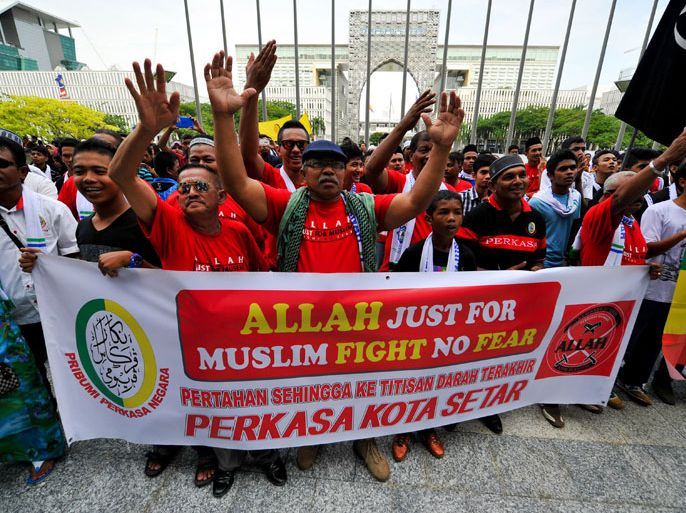 Muslim Protestors display a banner during a demonstration against a Malaysian Catholic newspaper using the word 'Allah' at the court of appeal in Putrajaya, outside Kuala Lumpur on October 14, 2013. An appeals panel ruled on October 14, that a Malaysian Catholic newspaper could not use "Allah" to refer to the Christian god in a case that sparked attacks on churches three years ago.