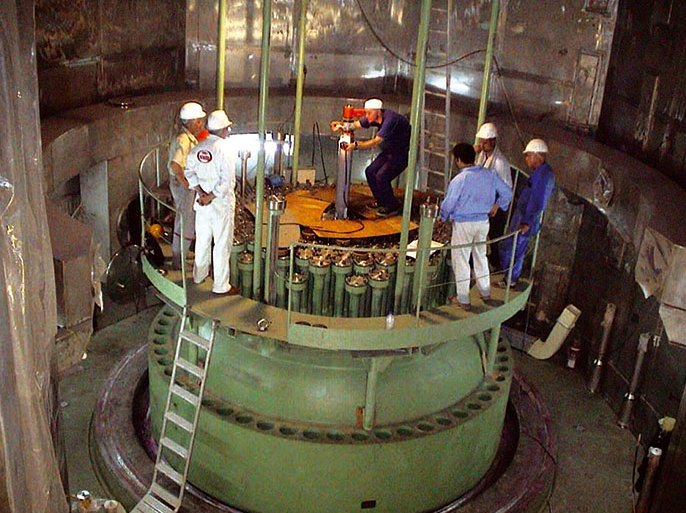 (FILES) Undated picture provided by Iranian Atomic Energy Organization showing shows Iranian and Russian workers working on a reactor core barrel inside the nuclear power plant in Bushehr. The IAEA board was meeting in Vienna Monday 13 September 2004 to consider Iran's nuclear programme and a November deadline set for it to comply with obligations under the Nuclear Non-Proliferation Treaty, to which Iran is a signatory. The United States has taken a hard line on the Iranian nuclear programme and is pushing the IAEA to refer Iran to the U.N. Security Council. But Britain, France and Germany are pursuing a policy of engagement wi