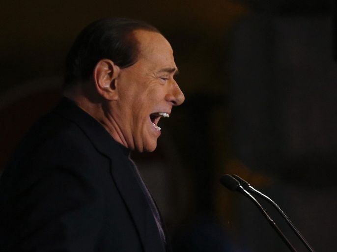 Former Prime Minister Silvio Berlusconi delivers a speech from the stage in downtown Rome November 27, 2013. The Italian Senate on Wednesday expelled Silvio Berlusconi from parliament following his conviction for tax fraud, in what the centre-right leader called a day of mourning for Italian democracy. REUTERS/Alessandro Bianchi (ITALY - Tags: POLITICS)