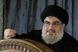 The head of Lebanon's militant Shiite Muslim movement Hezbollah, Hassan Nasrallah speaks during a rare live appearance from Beirut's southern suburb neighbourhood of Rweiss on November 13, 2013