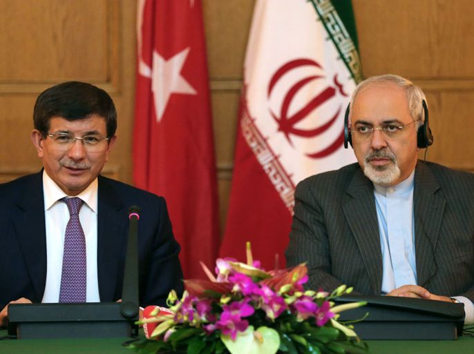 Iranian Foreign Minister Mohammad Javad Zarif (R) gives a joint press conference with his Turkish counterpart Ahmet Davutoglu on November 27, 2013 on the sidelines of the two-day ministerial conference of the Economic Cooperation Organisation (ECO), which groups 10 Asian and Eurasian countries in Tehran. AFP