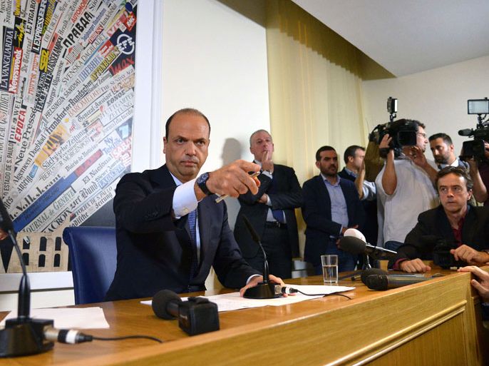 APZ560 - Rome, -, ITALY : Italy's deputy prime minister Angelino Alfano (L) gestures during a press conference in Rome on November 16, 2013. Silvio Berlusconi's centre-right party has split, in the latest blow for the scandal-tainted billionaire ex-premier, who may be voted out of parliament at the end of the month. Alfano, Berlusconi's former right-hand man, announced he would not remain at the side of his onetime mentor and would form his own party instead. AFP PHOTO / ALBERTO PIZZOLI