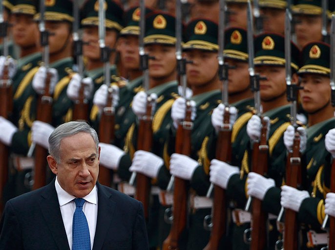 Israel's Prime Minister Benjamin Netanyahu (L) reviews the honour guards during an official welcoming ceremony at the Great Hall of the People in Beijing in this May 8, 2013 file photo. Long determined to deprive Islamist groups of funding,