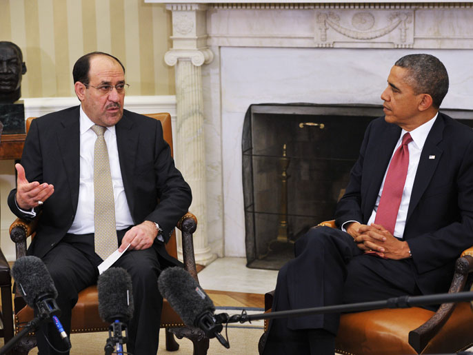 ‪‬ أوباما (يمين): أبلغنا المالكي أنه لا توجد قوة نارية تبقي العراق موحدا(الفرنسية)