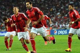 Al-Ahly's forward Mohamed Aboutrika (C) celebrates after scoring a goal during the African Champions League first leg final between South Africa's Orlando Pirates and Egypt's Al-Ahly in Soweto on November 2, 2013. AFP PHOTO / ALEXANDER JOE