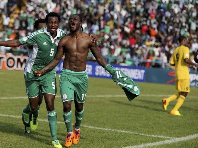 Victor Moses of Nigeria (R) celebrates after scoring a goal against Ethiopia during their 2014 World Cup qualifying playoff soccer match at U.J Esuene stadium in Calabar November 16, 2013. REUTERS/Afolabi Sotunde (NIGERIA - Tags: SPORT SOCCER)