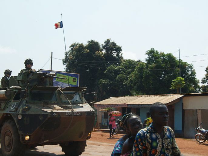 A French army armored vehicle patrols in Bangui on November 27, 2013. France announced on November 26 it would deploy about 1,000 soldiers to Central African Republic, in addition to the 400 already stationed at in Bangui, to take on an active fighting role alongside a flagging African-led "stabilisation mission", as long as the United Nations Security Council agreed to the move. As France announced its intention to send hundreds of more troops to Central African Republic, residents expressed their impatience for action on marauding gangs who murder, rape and burn down villages with impunity. AFP