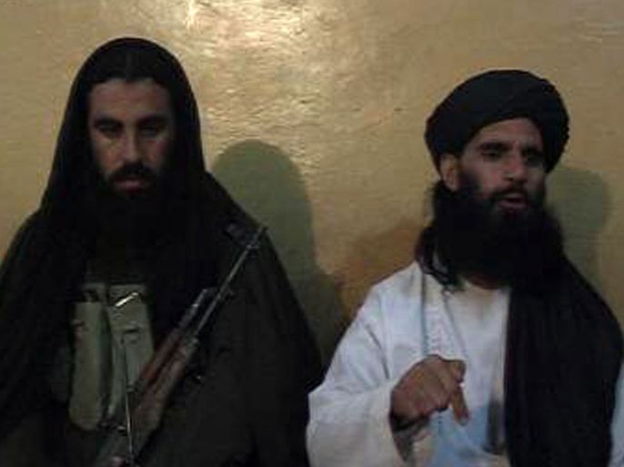 This video grab taken on November 7, 2013, shows Asmatullah Shaheen (R) caretaker chief Tehreek-e-Taliban Pakistan (TTP) announcing the new leader of TTP during a press conference in an undisclosed location in northwest Pakistan. The Pakistani Taliban appointed a hardline cleric linked to the attack on Malala Yousafzai as their new chief on November 7, throwing proposed peace talks with the government into serious doubt. Maulana Fazlullah, elected by the Taliban's supreme council, led the militants' brutal two-year rule in Pakistan's northwest valley of Swat in 2007-2009, before a military operation retook the area. AFP PHOTO