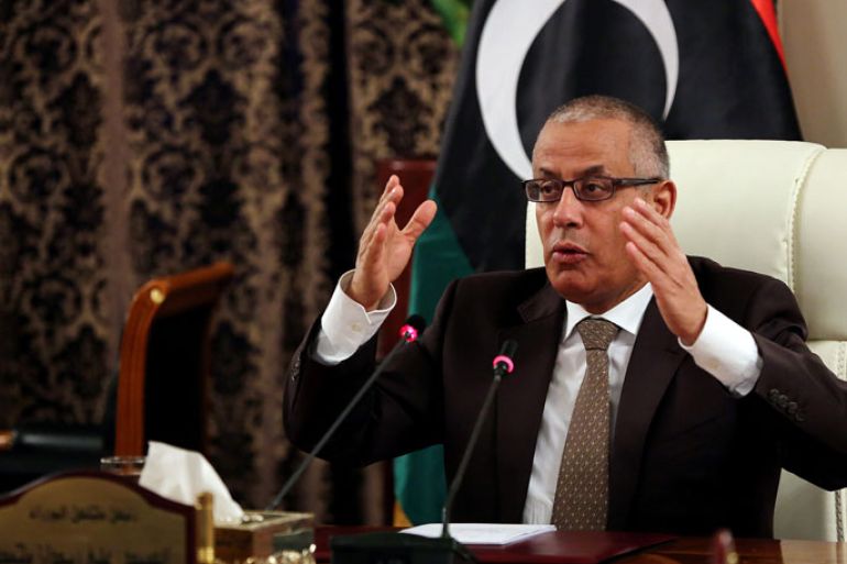 Libyan Prime Minister Ali Zeidan gives a press conference on November 10, 2013 in Tripoli. Zeidan warned Libyans of the possibility of foreign powers intervening unless the country's current chaos ends, in an appeal Sunday aimed at rallying his campaign against militias