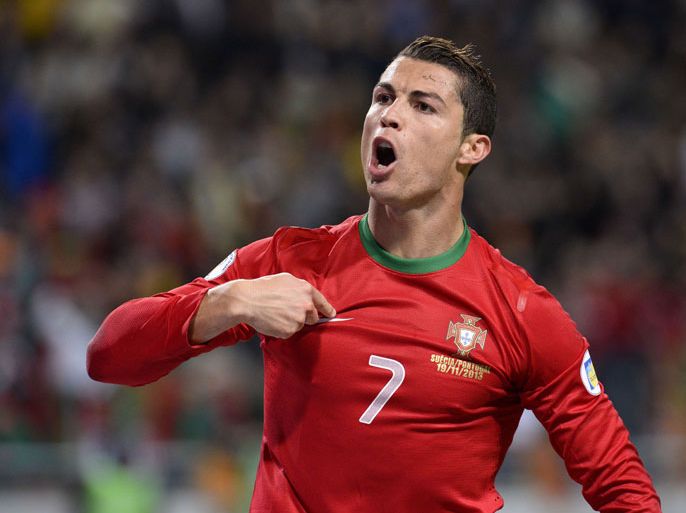 TOPSHOTSPortugal's forward Cristiano Ronaldo celebrates after scoring the second goal for Portugal during the FIFA 2014 World Cup playoff football match Sweden vs Portugal at the Friends Arena in Solna near Stockholm on November 19, 2013 . AFP PHOTO/ JONATHAN NACKSTRAND