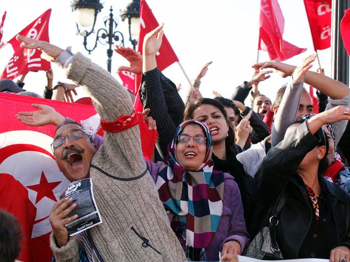 Tunisian protesters shoot slogans during an anti government demonstration on November 15, 2013 in Tunis. Around 250 people took part in the protest shouting slogans like "move along" and asking the resignation of the ruling Islamist party Ennahda. AFP PHOTO / FETHI BELAID