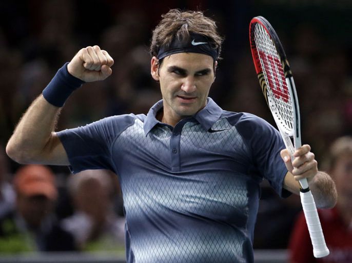 TOPSHOTSSwitzerland's Roger Federer celebrates after defeating Argentina's Juan Martin Del Portro during their quarter final match at the ninth and final ATP World Tour Masters 1000 indoor tennis tournament on November 1, 2013 at the Bercy Palais-Omnisport (POPB) in Paris. AFP PHOTO / KENZO TRIBOUILLARD