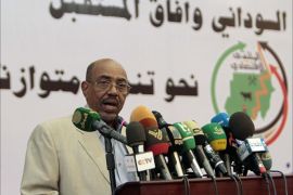 Sudan's President Omar al-Bashir speaks during the second Economic Forum, in the capital Khartoum on November 23, 2013. Khartoum lost billions of dollars in export earnings when South Sudan became independent in 2011, taking with it most of Sudan's oil production. AFP PHOTO / ASHRAF SHAZLY