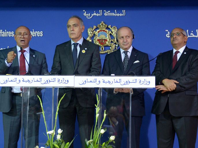Foreign Ministers Libyan Mohamed Abdelaziz, Moroccan Salaheddine Mezouar, French Laurent Fabius and Malian Zahabi Ould sidi Mohamed attend a press conference in Rabat on November 14, 2013 during a regional conference on border security. Ministers from countries across the Sahel and Maghreb gathered in Rabat seeking to boost border security and confront Islamist linked-violence plaguing the vast desert region. AFP PHOTO
