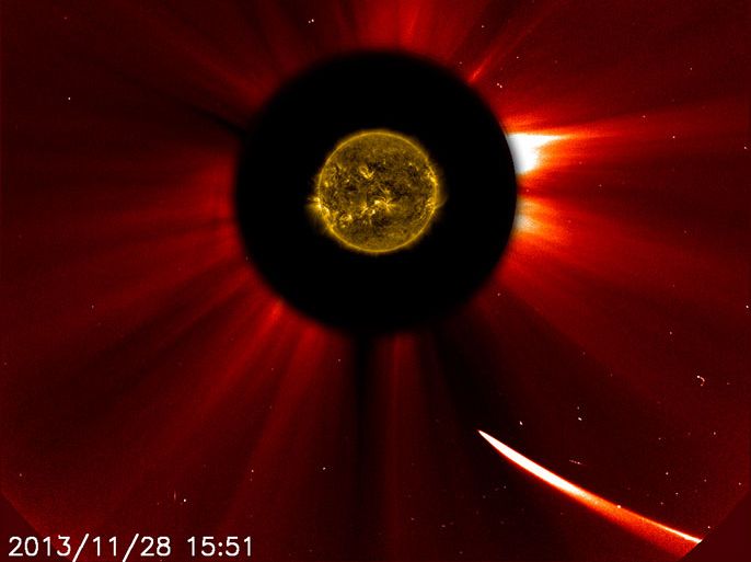 In this composition image obtained from NASA, Comet ISON (bottom) moves towards the sun in this image from ESA/NASA's Solar and Heliospheric Observatory captured at 10:51 a.m. EST on November 28, 2013. This image is a composite, with the sun imaged by NASA's Solar Dynamics Observatory in the center, and SOHO showing the solar atmosphere, the corona. NASA spacecraft and scientists are watching the comet to see if it survives its perilous journey around the sun. = RESTRICTED TO EDITORIAL USE - MANDATORY CREDIT "AFP PHOTO / ESA/NASA/SOHO/SDO" - NO MARKETING NO ADVERTISING CAMPAIGNS - DISTRIBUTED AS A SERVICE TO CLIENTS =