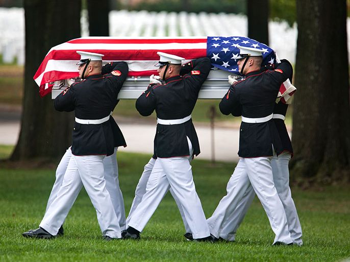 Members of the U.S. Marines carry the remains of seven missing Marines from World War II, being buried as a group in a single casket, during a burial service at Arlington National Cemetery in Arlington, VA USA, 04 October 2012. The Marines are: 1st Lieutenant Laverne A. Lallathin, 2nd Lieutenant Dwight D. Ekstam, 2nd Lieutenant Walter B. Vincent, Jr., Tech. Sergent James A. Sisney, Corporal Wayne R. Erickson, Corporal John D. Yeager, and Private First Class John A. Donovan. EPA/JIM LO SCALZO