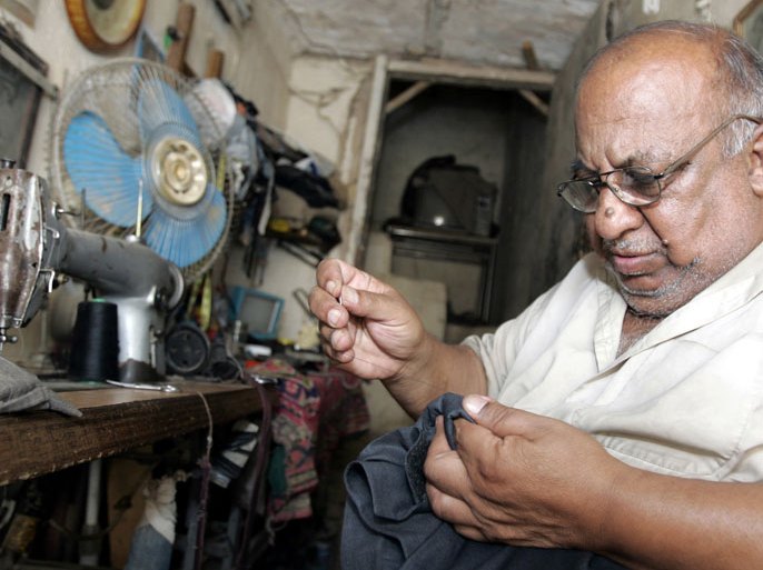 Iraqi tailor Ashour Hassib, 65, is repairing clothes at his workshop in Baghdad's Rasheed street, Iraq, 26 May 2009. Hassib has been working in the tailoring profession since fifty years and said that most of his customers are primarily poor people who hand in their torn and worn out clothes to have them repaired for a small fee. EPA/ALI ABBAS