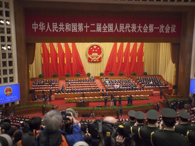 epa03628408 A general view of the closing session of the National Peoples Congress (NPC) in the Great Hall of the People in Beijing, China, 17 March 2013. China's nominal state parliament closed after installing a new leadership line up with Xi Jinping as President and Li Keqiang as Premier. EPA/ADRIAN BRADSHAW