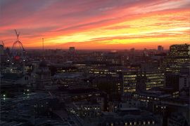The sun sets over central London, on November 13, 2013. PHOTO / LEON NEAL