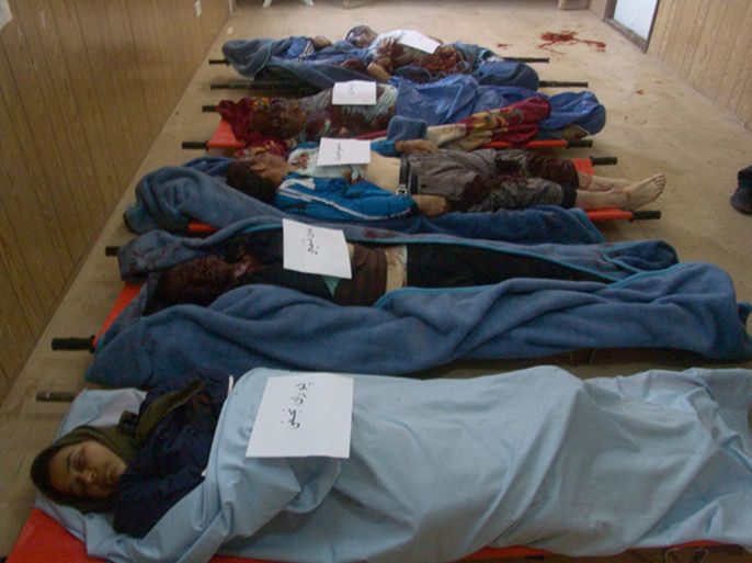 Slain bodies are seen on stretchers after a rocket attack on a camp belonging to Iranian dissident group Mujahadin-e-Khalq (MEK) in Baghdad February 9, 2013. in this picture provided by MEK. At least five people were killed and twenty wounded in the attack which occurred early on Saturday, police sources said. MEK said six people including a woman had died after its camp was hit by mortars and missiles, while the U.N. mission in Iraq said it was aware of a number of deaths. (IRAQ - Tags: CIVIL UNREST POLITICS) REUTERS/Mujahadin-e-Khalq (MEK)/Handout (IRAQ - Tags: CIVIL UNREST POLITICS)