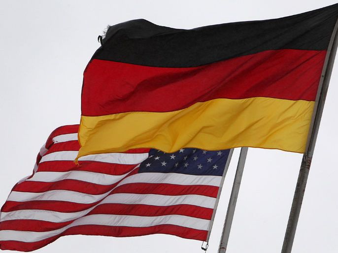 The German and the US flags fly at the US Airbase in Ramstein, southern Germany, on November 6, 2013. The German government is to study whether US fugitive leaker Edward Snowden can be questioned in Russia, as it sought to calm tensions with Britain and Washington over spy allegations.