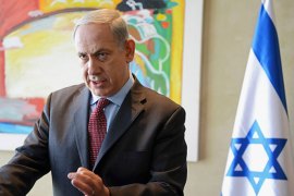 Israeli Prime Minister Benjamin Netanyahu gestures as he delivers a statement to the media after meeting U.S. Secretary of State John Kerry at Ben Gurion Airport near Tel Aviv November 8, 2013.