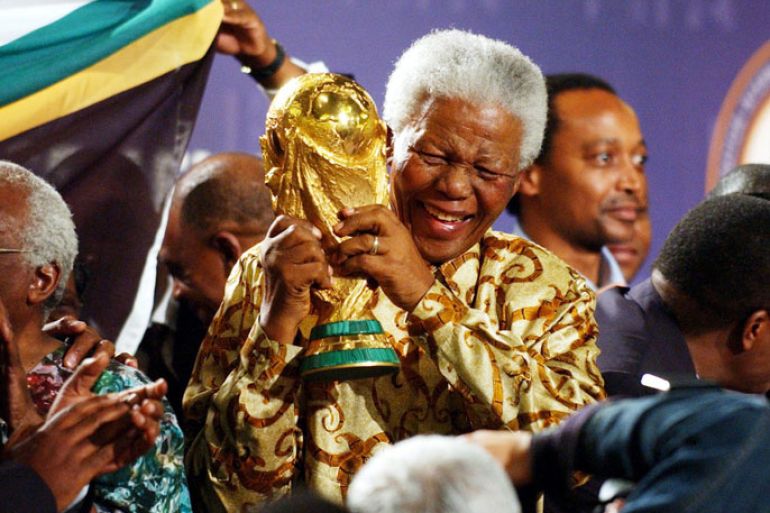 epa03978366 (FILE) A file picture dated 14 May 2004 shows Nobel Peace Prize winner and iconic political prisoner Nelson Mandela lifting the World Cup trophy in Zurich, Switzerland, after it was announced that South Africa will host the Soccer World Cup 2010. According to media reports Nelson Mandela has died aged 95, in Johannesburg, South Africa, on 05 December 2013. A former lawyer, Mandela was the first black President of South Africa voted into power after the countries first free and fair democratic elections that witnessed the end of the Apartheid system in 1994. Mandela was founding member of the ANC (African National Congress) and anti-apartheid activist who served 27 years in prison, spending many of these years on Robben Island. In South Africa, Mandela is often known as uTata Madiba, an honorary title adopted by elders of Mandela's clan. Mandela won the Nobel Peace Prize in 1993. EPA/STEFFEN SCHMIDT